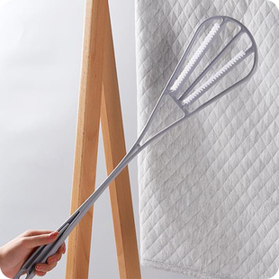 a quilt beater with long handle and double sides for cleaning and beating quilt