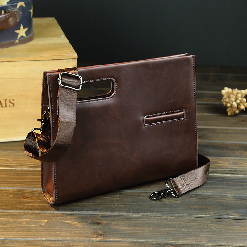 sac fourre-tout des hommes, paquet diagonale paquet d'hommes de mains tenant l'ipad sac d'épaule de sac d'épaule unique sac fourre-tout des hommes, paquet diagonale paquet d'hommes de mains tenant l'ipad sac d'épaule de sac d'épaule unique