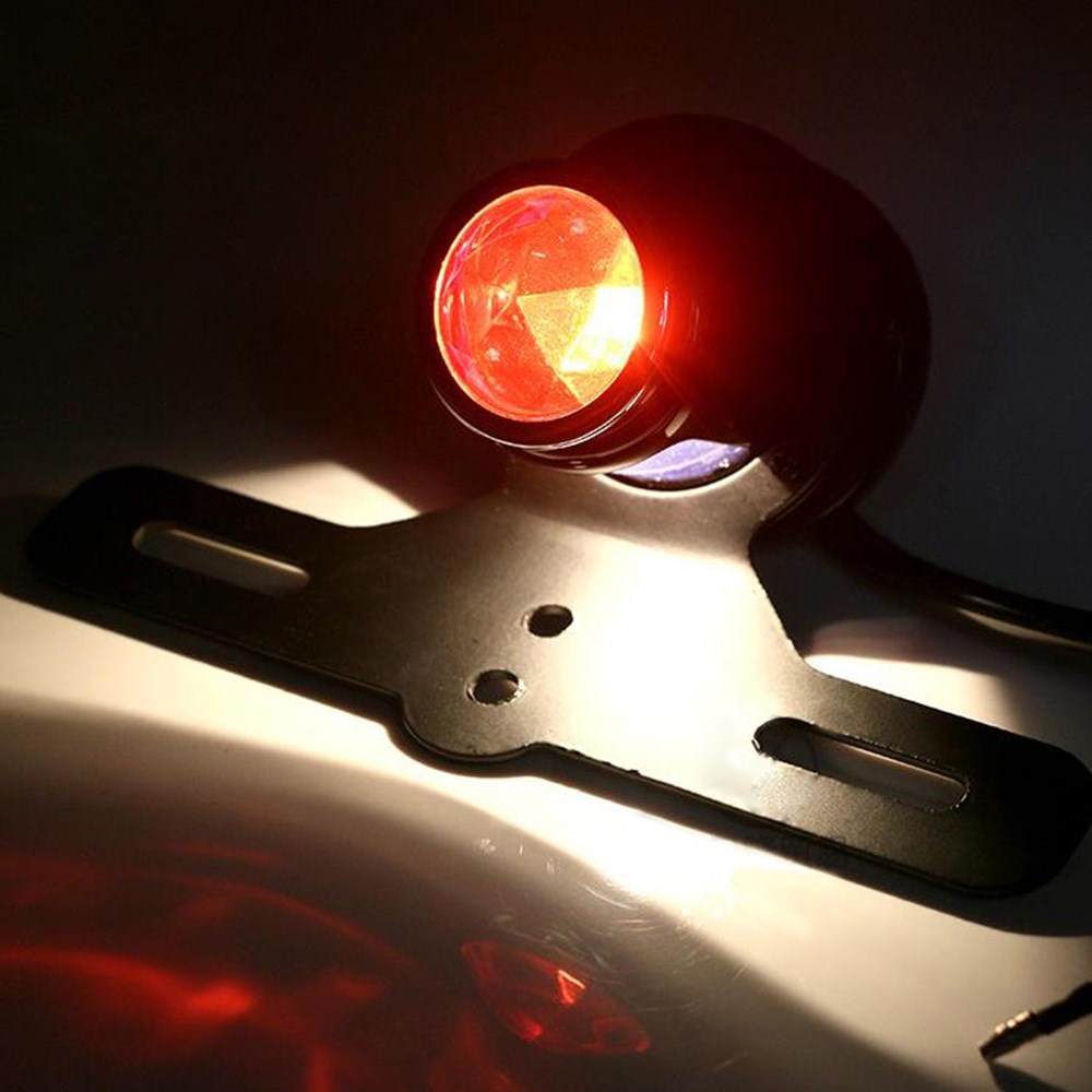 Phụ kiện xe máy sửa đổi retro phổ quát phanh tròn toàn kim loại chạy đèn cảnh báo đèn hậu ruby ​​đèn hậu - Đèn xe máy