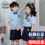 Quần áo trẻ em tay ngắn phù hợp với mẫu giáo quần áo kiểu Anh màu xanh nhạt Áo Tây Tạng xếp li váy màu xanh đồng phục học sinh tiểu học - Đồng phục trường học / tùy chỉnh thực hiện quần áo sành điệu cho be gái