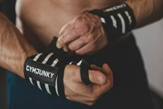 Cơ bắp captain america thể dục thể thao dây đeo cổ tay sức mạnh đào tạo thiết kế cổ tay đàn hồi băng chống quay thể thao dài đồ bảo hộ