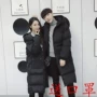 Hàn Quốc Dongdaemun đôi áo khoác mùa đông buông lơi trên đầu gối siêu dài xuống bông pad áo khoác nam và nữ áo khoác bomber nam