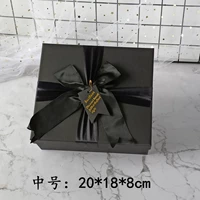 Черный бант-крестик среднего размера 20*18*8см.