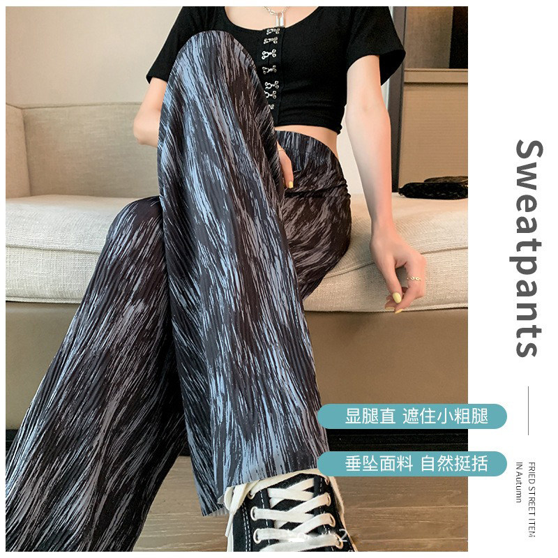 The new tie-dyed wide-leg pants for women in the summer of 2022 from South Korea are loose, slimming, and have a drooping effect. They are casual and thin ice silk floor-length pants