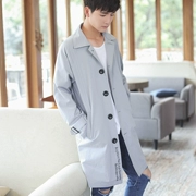 Phiên bản Hàn Quốc của áo khoác nam dài áo khoác thủy triều nam ve áo đơn ngực áo gió thanh niên màu xanh xám M - Áo gió thể thao