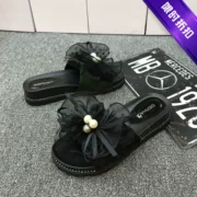 Gilcon 2019 mùa hè mới bằng da nơ rhinestone sandal nữ dày từ dưới kéo bên ngoài mang dép xốp bánh - Dép
