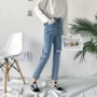 Mùa xuân mới của phụ nữ phiên bản Hàn Quốc của quần lửng lỗ rộng bất thường quần jean cạp cao retro cá tính quần jean rách gối nữ