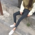 Thu đông phiên bản Hàn Quốc eo cao đa năng Mỏng mỏng co giãn đen lỗ rách chín điểm quần jeans nữ chân quần thủy triều