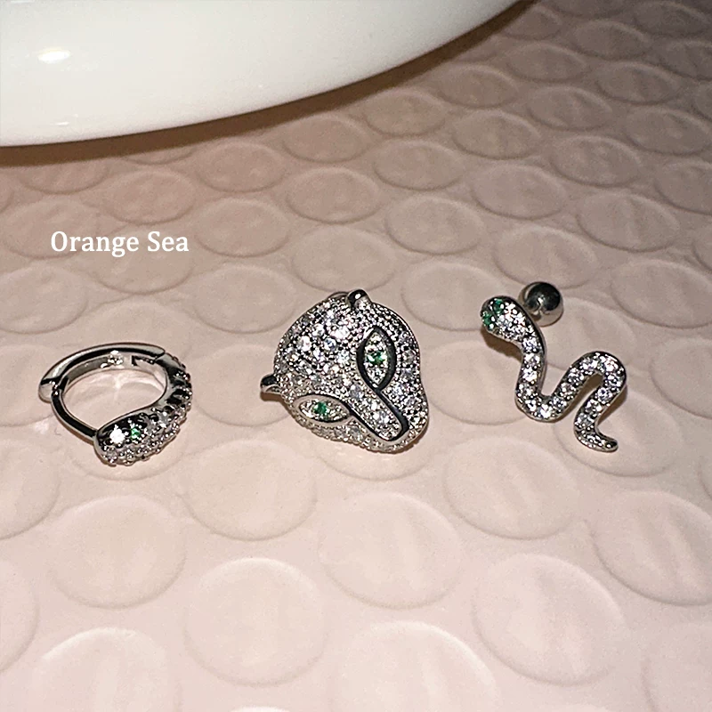 Оранжевые морские супер-ускоряющие острые серьги Девушка дикий Diamond Зеленый глаз Змея Леопард Ниша Винт Ear Bone Nail