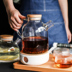 Sheri borosilicate thủy tinh chịu nhiệt công suất lớn chống cháy nổ lọc ấm trà ấm trà hoa trà ấm trà bộ có thể được mở lửa Trà sứ