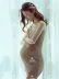 Phụ nữ mang thai ảnh ảnh quần áo nhỏ tươi chụp ảnh quần áo treo váy đan thun mỏng váy studio - Áo thai sản các kiểu áo bầu đẹp Áo thai sản