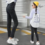 Quần jeans bé gái mùa xuân và chân mùa thu kéo dài quần 6-12 tuổi trẻ em mùa xuân 8 quần đen trẻ em - Quần jean