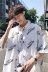 Hua Tsai mặc áo sơ mi hè 2019 Hồng Kông INS nam phiên bản Hàn Quốc rộng kích thước in họa tiết tay áo ngắn tay năm điểm - Áo