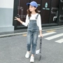 Cô gái denim bib 2019 xuân mới trẻ em phiên bản Hàn Quốc của cô gái nước ngoài Cô gái nhỏ quần jeans trẻ em quần lớn - Quần jean quần áo trẻ con