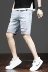 Mùa hè xé quần jeans năm điểm nam phiên bản Hàn Quốc của sinh viên tự tu theo xu hướng giản dị quần short nam màu sáng - Quần jean