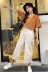 Thời trang vui tươi phù hợp với phụ nữ Hàn Quốc phiên bản của màu sắc hoang dã ngắn tay T-Shirt + cao eo hoa side loose quần âu Bộ đồ