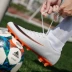 C Luo Assassin giúp giày bóng đá nam gãy móng tay TF trẻ em nam nữ trượt AG gai giày thể thao đào tạo