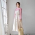 2018 mùa thu mới Hàn Quốc phiên bản của gừng dây đeo bông và vải lanh váy eo phần dài đơn ngực Một từ váy nữ