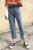 Hồng Kông hương vị retro Hàn Quốc chic gió lỏng hoang dã không đối xứng cao quăn chín quần cao eo là quần jean mỏng phụ nữ quần jean rách gối nữ Quần jean