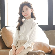 Quần áo trẻ em 2019 mùa xuân Hàn Quốc Cô gái bông trắng Đèn lồng tay áo Big Boy đứng cổ áo sơ mi lỏng lẻo - Áo sơ mi