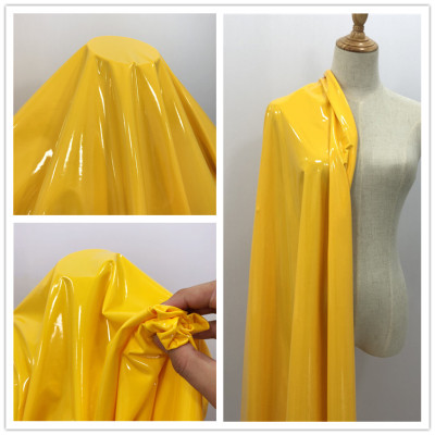 taobao agent Bright yellow super bright and smooth mirror leather High elastic knitted leather cloth- four-way stretch PU fabric fabric