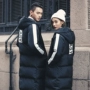 Cặp đôi mùa đông mặc áo khoác đầu gối Phiên bản Hàn Quốc của những người đàn ông và phụ nữ mảnh mai dài làm dày lên xuống áo khoác lông bông áo thun polo nam