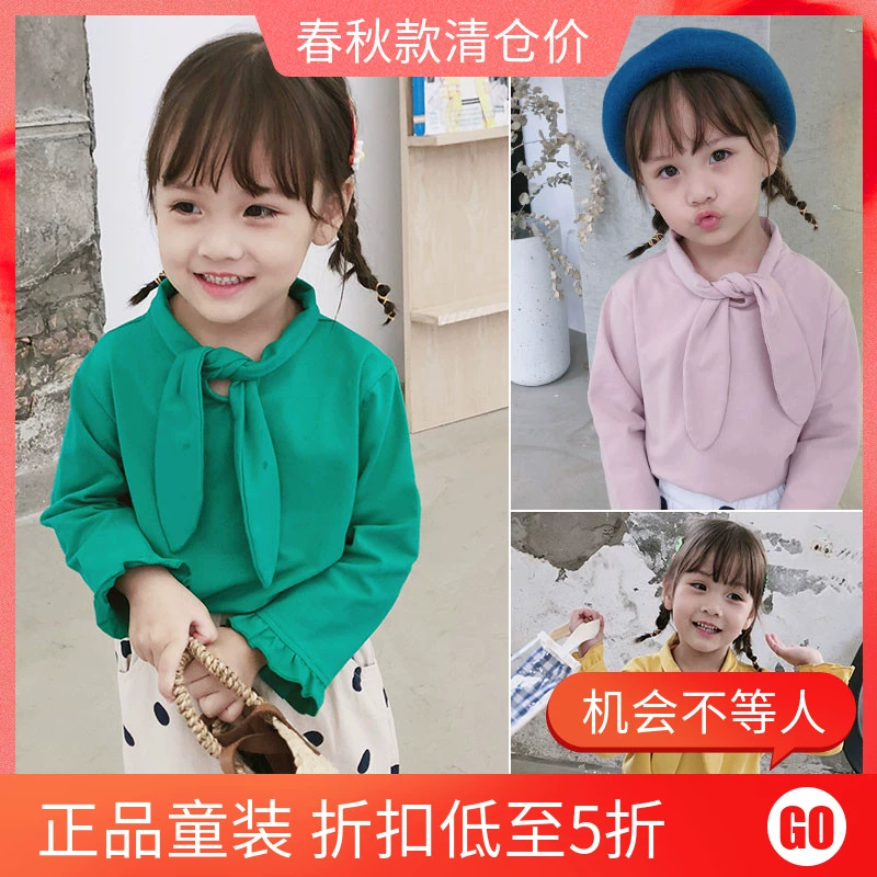 Áo thun bé gái mùa thu 2019 mới bé gái bé gái nửa tay thủy triều quần áo trẻ em phong cách nước ngoài trẻ em Hàn Quốc thắt nơ bông - Áo thun