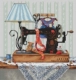 Швейная машина с синей настенной лампой