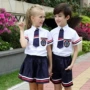 Áo mẫu giáo sân vườn cotton mùa hè Anh gió đồng phục trường tiểu học trang phục lớp trẻ em dịch vụ tùy chỉnh hiển thị bộ quần áo cotton đẹp cho bé