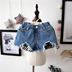 Quần short trẻ em vừa và nhỏ quần short 2018 mùa hè cô gái mới hoang dã giản dị lưới denim trẻ em của denim liệu quần nóng Quần jean