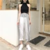 Hong Kong-phong cách retro chic slim treo cổ chữ thập eo vest top + cao eo đa năng quần chân phù hợp với phụ nữ Bộ đồ