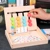 Trẻ em tập thể dục đồ chơi giáo dục logic suy nghĩ đào tạo trò chơi lực lượng phản ứng bốn màu phù hợp Montessori mầm non 3-6 tuổi 5 Đồ chơi bằng gỗ